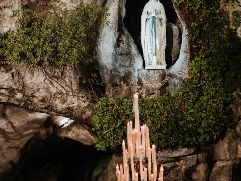 white angel statue on brown rock