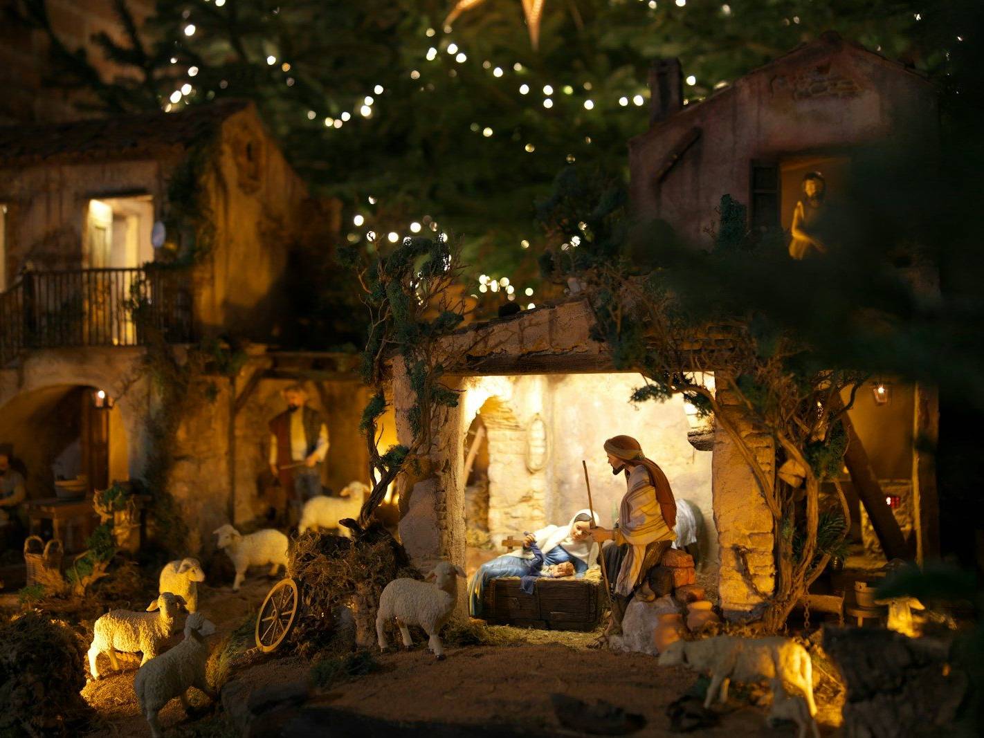 A nativity scene with a man and a baby in a manger scene