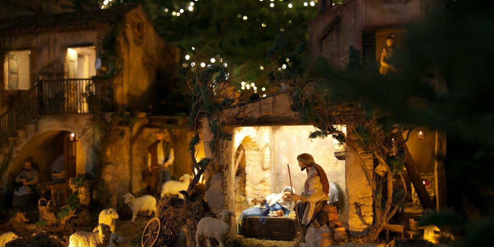 A nativity scene with a man and a baby in a manger scene